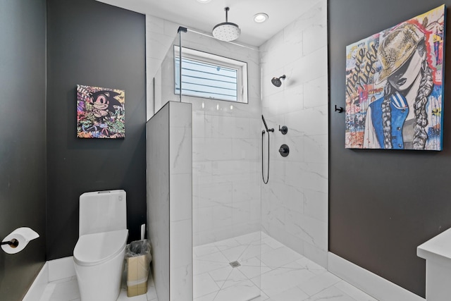 1203B Brick Church Pike, Nashville, TN 37207 - bathroom featuring toilet, tiled shower, and baseboards