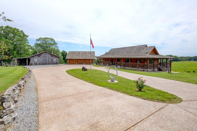 1820 Buck Smith Rd, Palmyra, TN 37142 - view of front of property featuring a front yard, a barn, an outbuilding, and driveway
