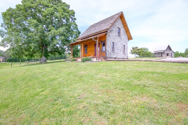 1820 Buck Smith Rd, Palmyra, TN 37142 - view of front facade featuring a front lawn and stone siding