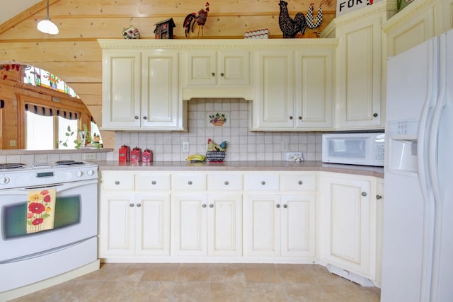 1820 Buck Smith Rd, Palmyra, TN 37142 - kitchen with white appliances, wood walls, light countertops, decorative backsplash, and cream cabinetry