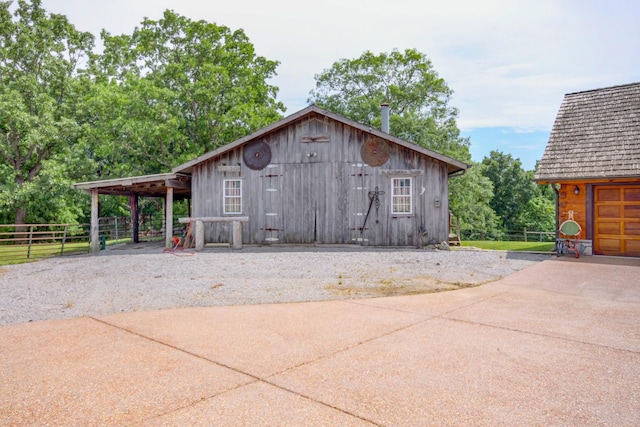 1820 Buck Smith Rd, Palmyra, TN 37142 - view of outdoor structure with driveway and a carport