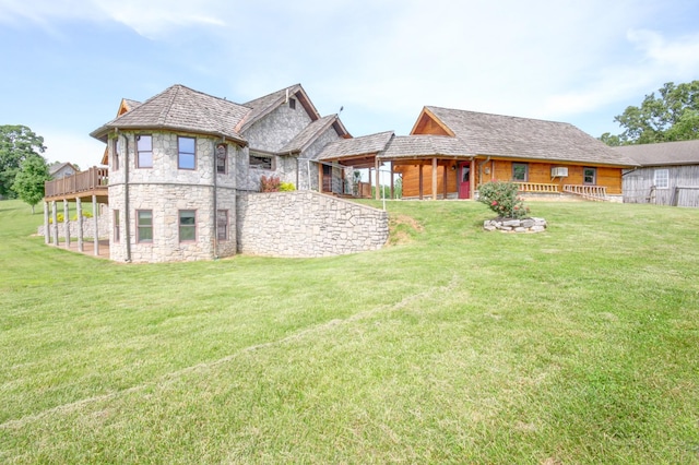 1820 Buck Smith Rd, Palmyra, TN 37142 - back of property with stone siding and a yard