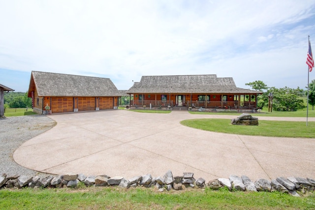 1820 Buck Smith Rd, Palmyra, TN 37142 - view of front of home featuring curved driveway, an outdoor structure, a front yard, and a detached garage