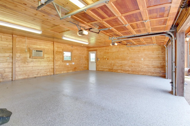 1820 Buck Smith Rd, Palmyra, TN 37142 - garage with a garage door opener, wooden walls, and a wall unit AC