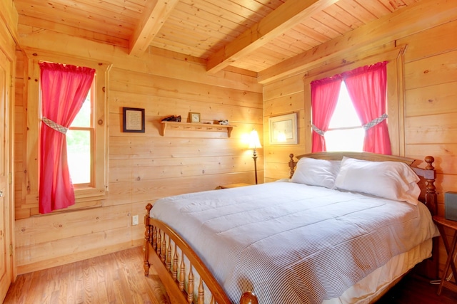 1820 Buck Smith Rd, Palmyra, TN 37142 - bedroom featuring multiple windows, wood walls, wooden ceiling with exposed beams, and wood finished floors