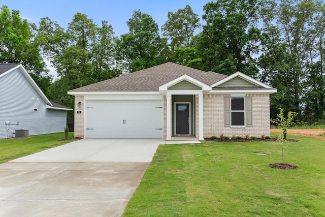 36 Aurora Cir, Fayetteville, TN 37334 - single story home featuring brick siding, concrete driveway, a garage, and a front yard