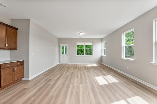 36 Aurora Cir, Fayetteville, TN 37334 - unfurnished living room featuring light wood-style flooring and baseboards