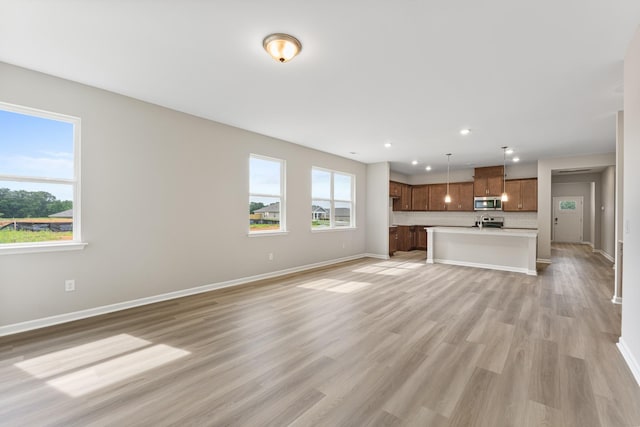 36 Aurora Cir, Fayetteville, TN 37334 - unfurnished living room with baseboards, light wood finished floors, and recessed lighting