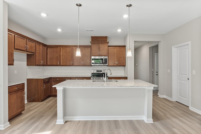 36 Aurora Cir, Fayetteville, TN 37334 - kitchen with stainless steel appliances, light wood-type flooring, a sink, backsplash, and recessed lighting
