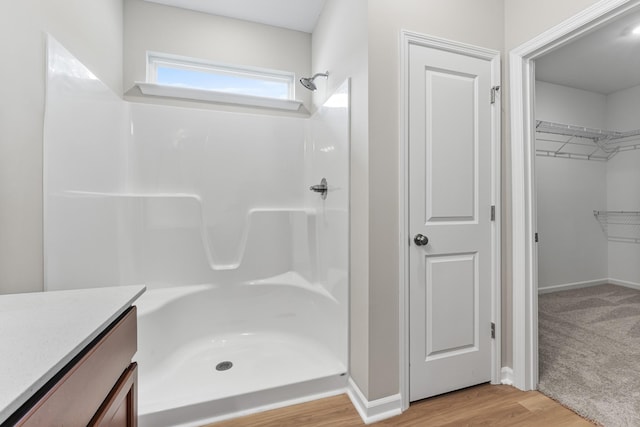 36 Aurora Cir, Fayetteville, TN 37334 - full bath featuring a shower, wood finished floors, a spacious closet, vanity, and baseboards