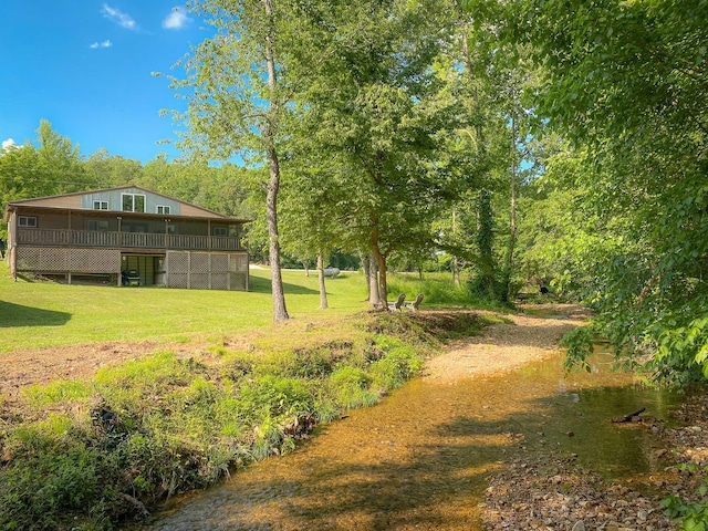 6969 Cuba Landing Rd, Waverly, TN 37185 - view of green lawn featuring a deck