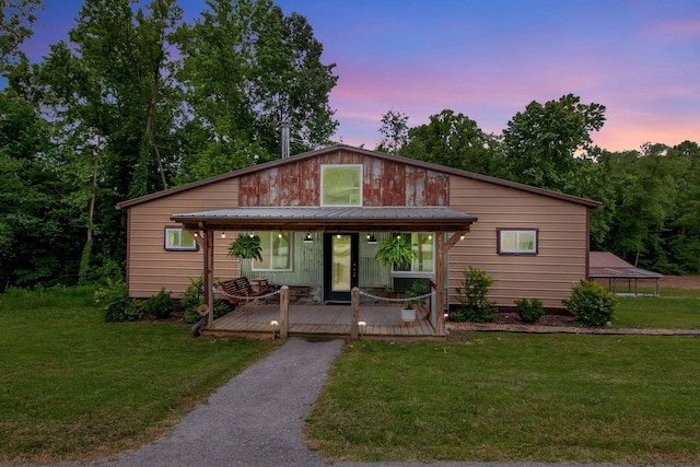 6969 Cuba Landing Rd, Waverly, TN 37185 - view of front facade featuring a deck and a yard