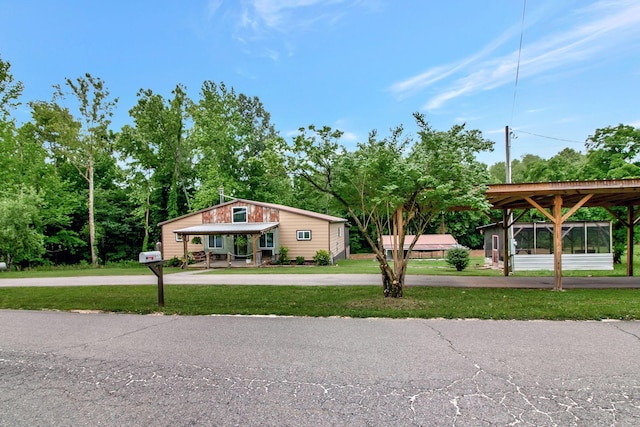 6969 Cuba Landing Rd, Waverly, TN 37185 - view of front of property featuring a front yard and curved driveway