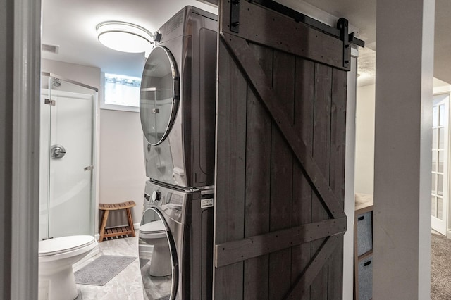 120 Brookhaven Dr, Gallatin, TN 37066 - bathroom with estacked washer and dryer, toilet, and a shower stall