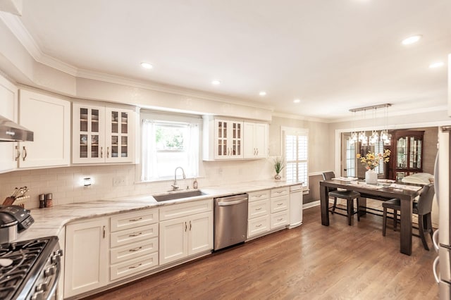 120 Brookhaven Dr, Gallatin, TN 37066 - kitchen with a sink, appliances with stainless steel finishes, ornamental molding, white cabinets, and decorative backsplash