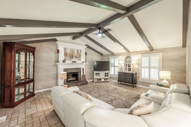 120 Brookhaven Dr, Gallatin, TN 37066 - living room featuring a high end fireplace, wooden walls, baseboards, and a ceiling fan