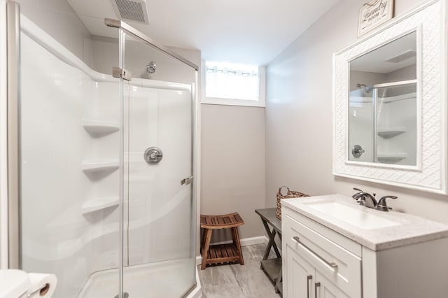 120 Brookhaven Dr, Gallatin, TN 37066 - full bathroom with a shower stall, vanity, marble look tile flooring, toilet, and baseboards