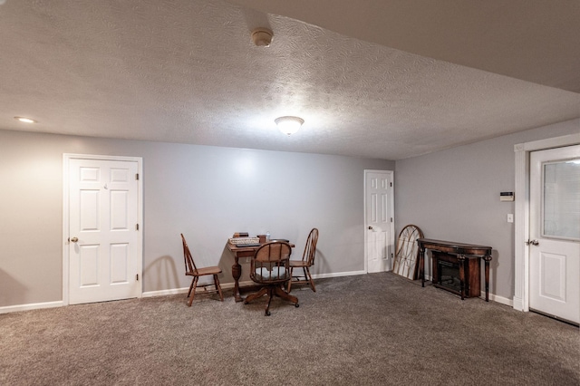 120 Brookhaven Dr, Gallatin, TN 37066 - carpeted dining space featuring baseboards, a textured ceiling, and a fireplace