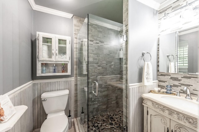 120 Brookhaven Dr, Gallatin, TN 37066 - bathroom featuring vanity, crown molding, wainscoting, a stall shower, and toilet