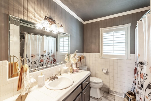 120 Brookhaven Dr, Gallatin, TN 37066 - bathroom with ornamental molding, toilet, healthy amount of natural light, vanity, and tile walls