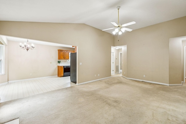 2956 Augusta Trace Dr, Spring Hill, TN 37174 - unfurnished living room featuring light carpet, lofted ceiling, a chandelier, ceiling fan, and baseboards