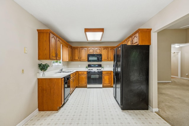 2956 Augusta Trace Dr, Spring Hill, TN 37174 - kitchen with black appliances, brown cabinetry, light countertops, and baseboards