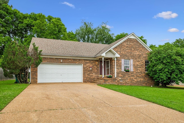 2956 Augusta Trace Dr, Spring Hill, TN 37174 - view of front of house featuring an attached garage, concrete driveway, brick siding, and a front yard