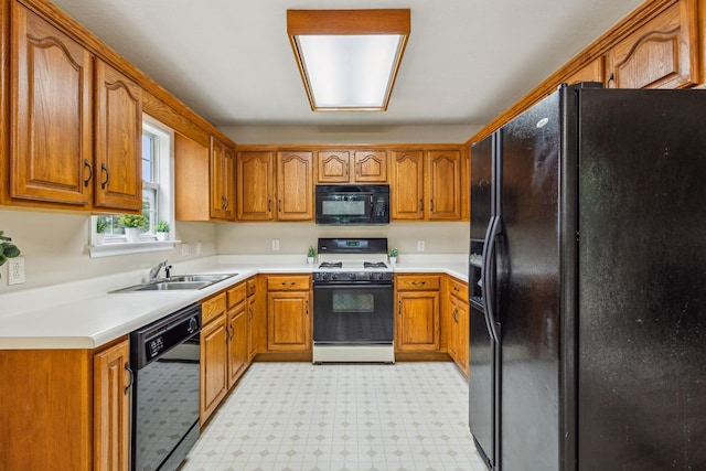 2956 Augusta Trace Dr, Spring Hill, TN 37174 - kitchen with black appliances, a sink, brown cabinets, and light flooring