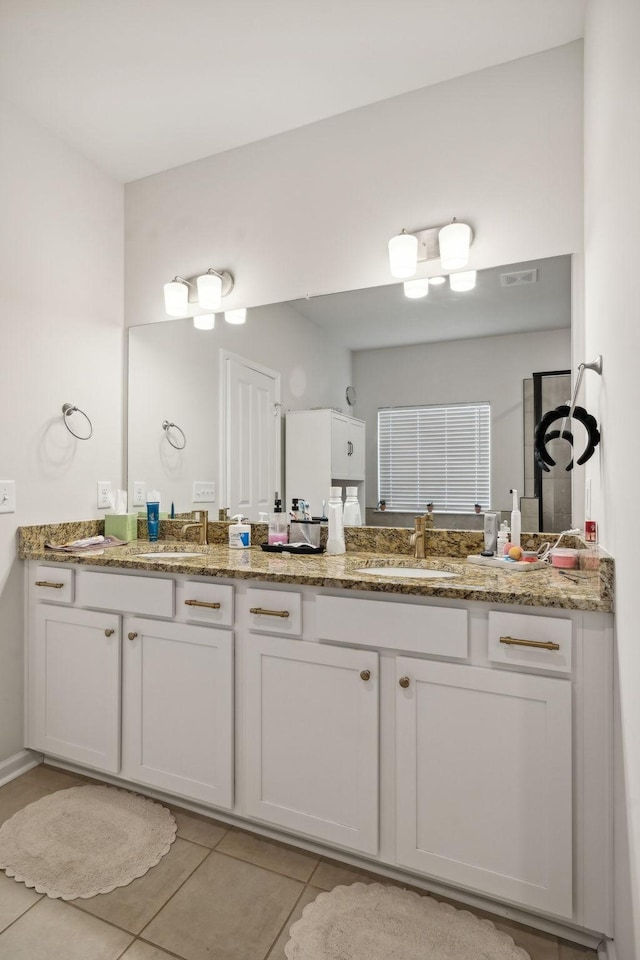 4537 Rockland Trl, Antioch, TN 37013 - full bathroom featuring double vanity and tile patterned floors