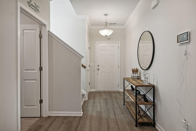 4537 Rockland Trl, Antioch, TN 37013 - entrance foyer featuring wood finished floors, baseboards, stairs, and crown molding