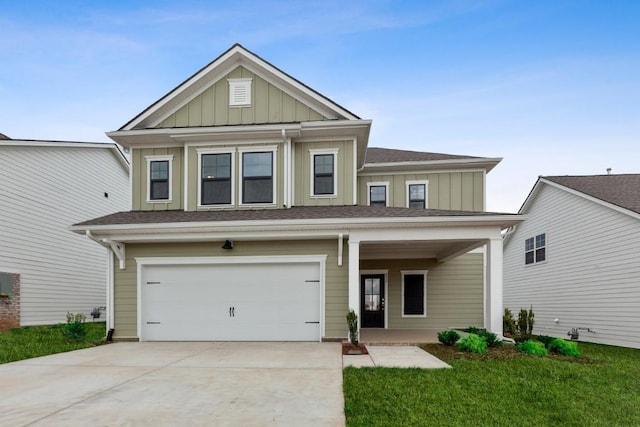 4537 Rockland Trl, Antioch, TN 37013 - view of front of home with board and batten siding, a garage, concrete driveway, and a shingled roof