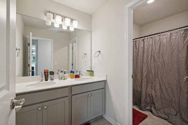 4537 Rockland Trl, Antioch, TN 37013 - full bathroom with double vanity, tile patterned floors, and a shower with curtain