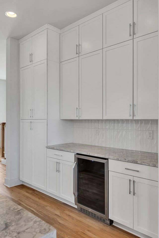 2514B Booker St, Nashville, TN 37208 - bar with wine cooler, light wood-style floors, tasteful backsplash, and recessed lighting