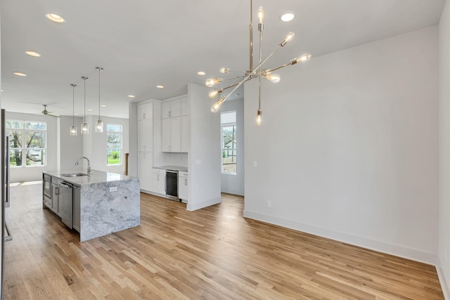 2514B Booker St, Nashville, TN 37208 - kitchen with a sink, light wood-type flooring, white cabinets, plenty of natural light, and recessed lighting