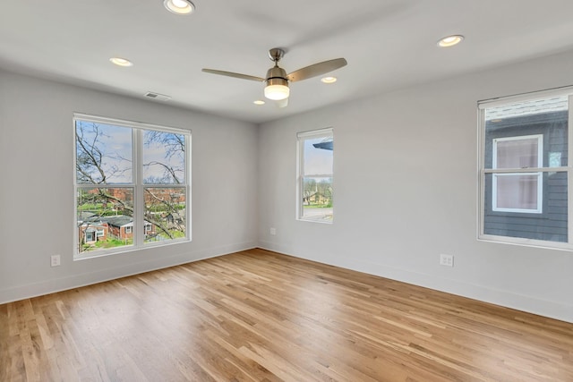 2514B Booker St, Nashville, TN 37208 - empty room with healthy amount of natural light, baseboards, light wood-style flooring, recessed lighting, and a ceiling fan