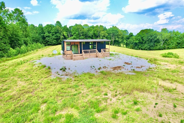68 Bassham Rd, Five Points, TN 38457 - rear view of house featuring a wooded view and a metal roof