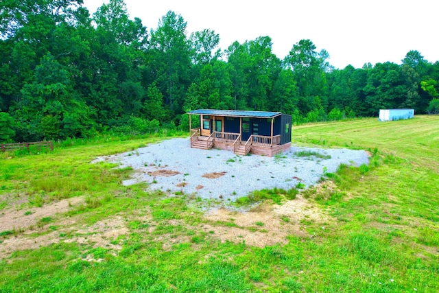 68 Bassham Rd, Five Points, TN 38457 - view of yard featuring a wooded view, an outbuilding, and a deck