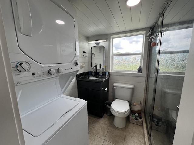 68 Bassham Rd, Five Points, TN 38457 - full bathroom featuring stacked washer / dryer, a shower with door, vanity, and tile patterned floors