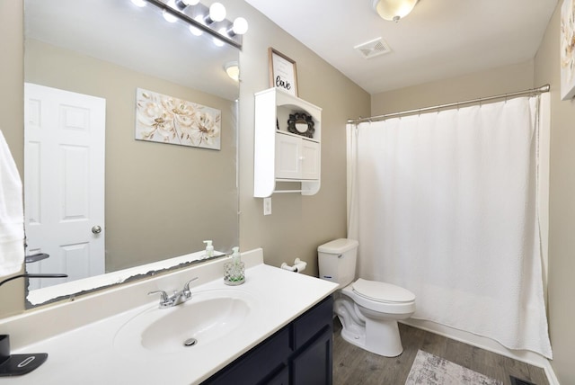 146 Sherron Dr, Dickson, TN 37055 - bathroom with toilet, vanity, wood finished floors, and a shower with shower curtain