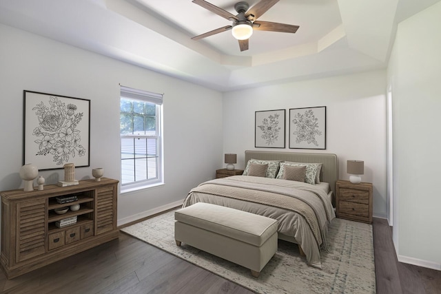 146 Sherron Dr, Dickson, TN 37055 - bedroom featuring baseboards, a tray ceiling, and wood finished floors