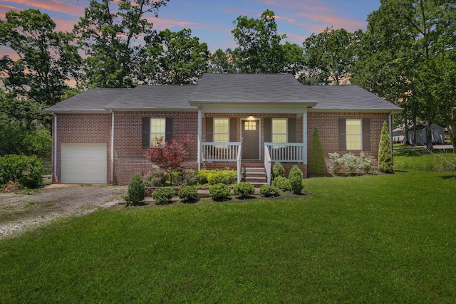 146 Sherron Dr, Dickson, TN 37055 - view of front of house with covered porch, brick siding, a front yard, and dirt driveway