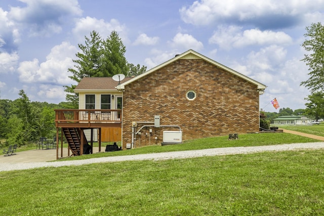 535 Dawson Rd, Cumberland Furnace, TN 37051 - rear view of property featuring stairway, a wooden deck, a lawn, and brick siding