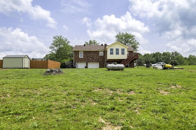 535 Dawson Rd, Cumberland Furnace, TN 37051 - view of yard featuring a garage, a storage shed, stairway, and a deck
