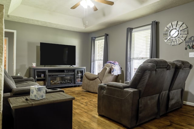 535 Dawson Rd, Cumberland Furnace, TN 37051 - living room featuring ceiling fan, a tray ceiling, and wood finished floors