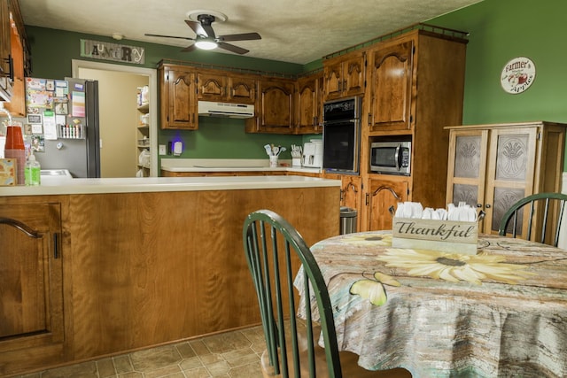 535 Dawson Rd, Cumberland Furnace, TN 37051 - kitchen featuring stainless steel appliances, under cabinet range hood, ceiling fan, and light countertops