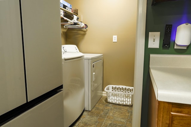 535 Dawson Rd, Cumberland Furnace, TN 37051 - washroom with washer and clothes dryer and stone finish floors