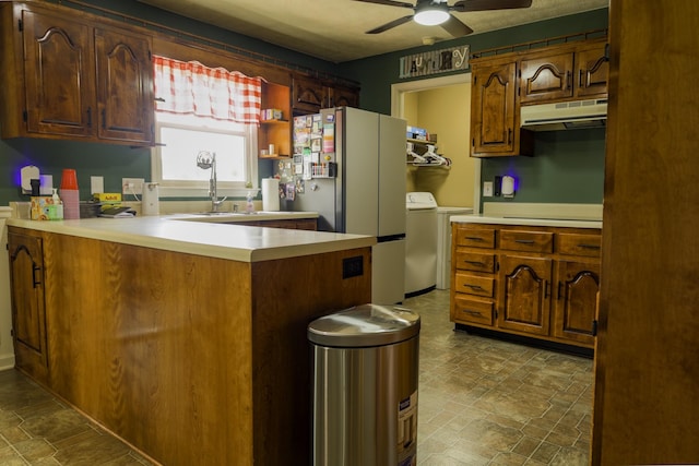 535 Dawson Rd, Cumberland Furnace, TN 37051 - kitchen featuring under cabinet range hood, freestanding refrigerator, ceiling fan, stone finish floors, and light countertops