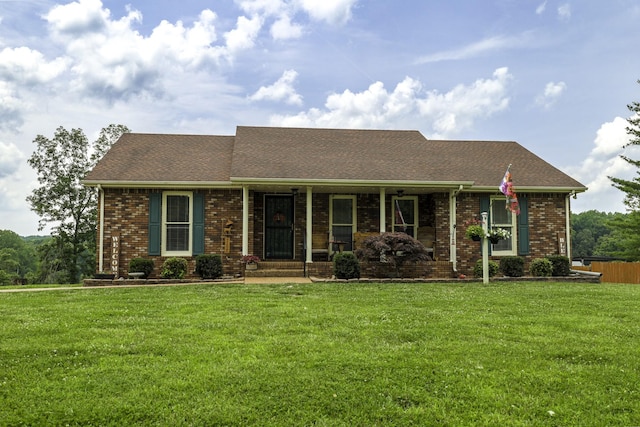 535 Dawson Rd, Cumberland Furnace, TN 37051 - view of front facade featuring a front lawn, brick siding, and roof with shingles