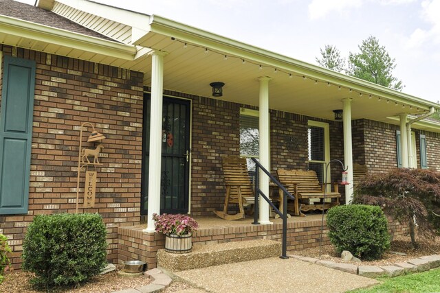 535 Dawson Rd, Cumberland Furnace, TN 37051 - entrance to property featuring covered porch and brick siding