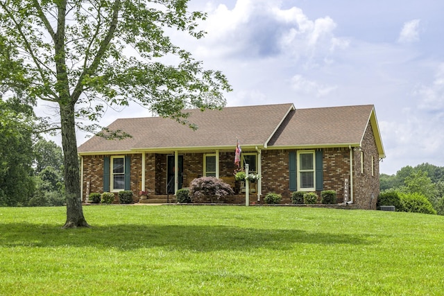 535 Dawson Rd, Cumberland Furnace, TN 37051 - view of front facade with a front lawn, brick siding, and a shingled roof
